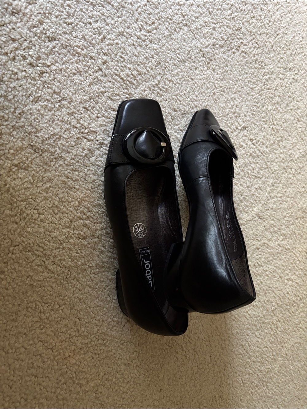 Gabor Black Leather Low Block Heel Pumps with Round Buckle Accent.